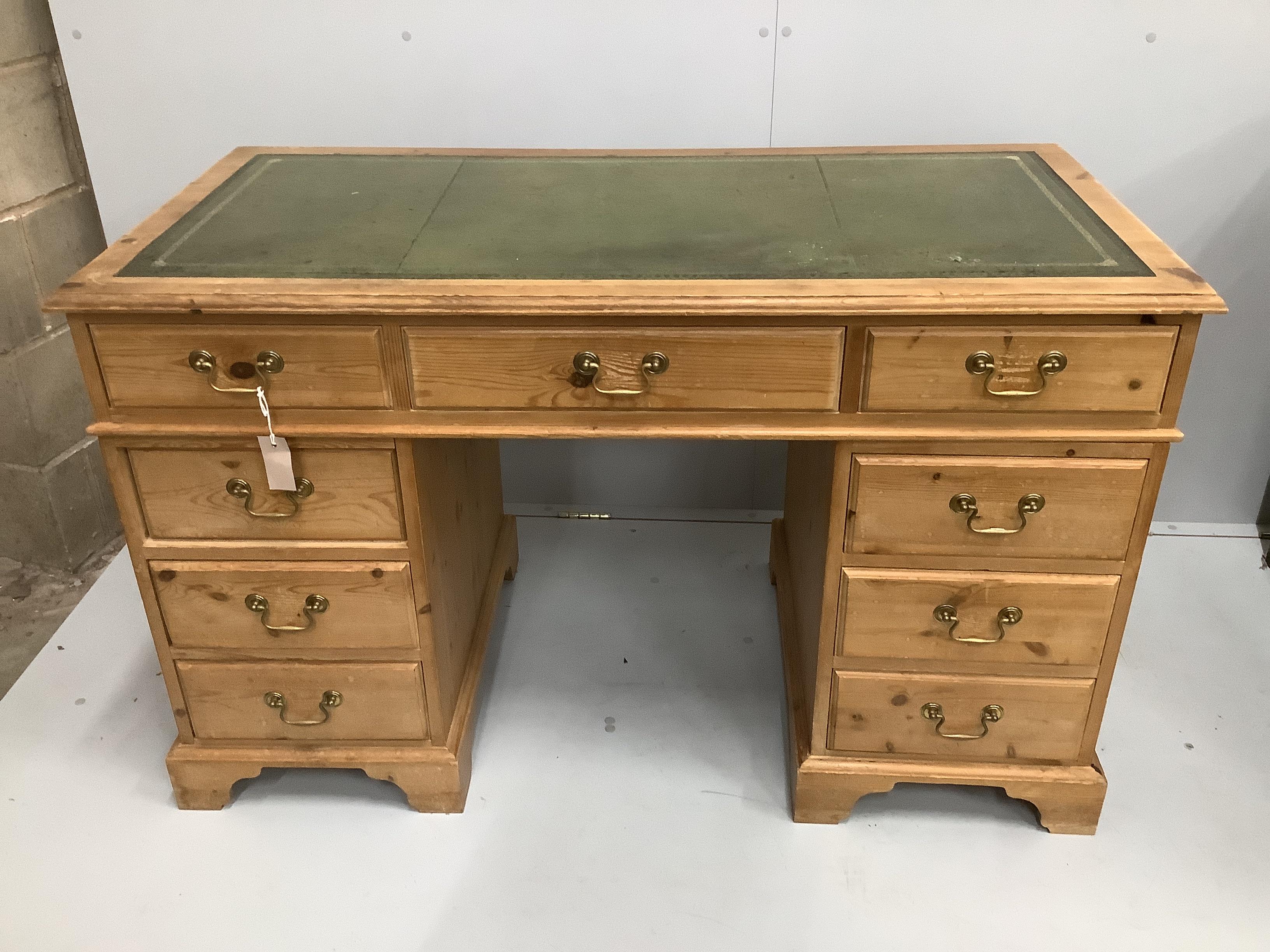 A Victorian style pine pedestal desk, width 128cm, depth 63cm, height 78cm.